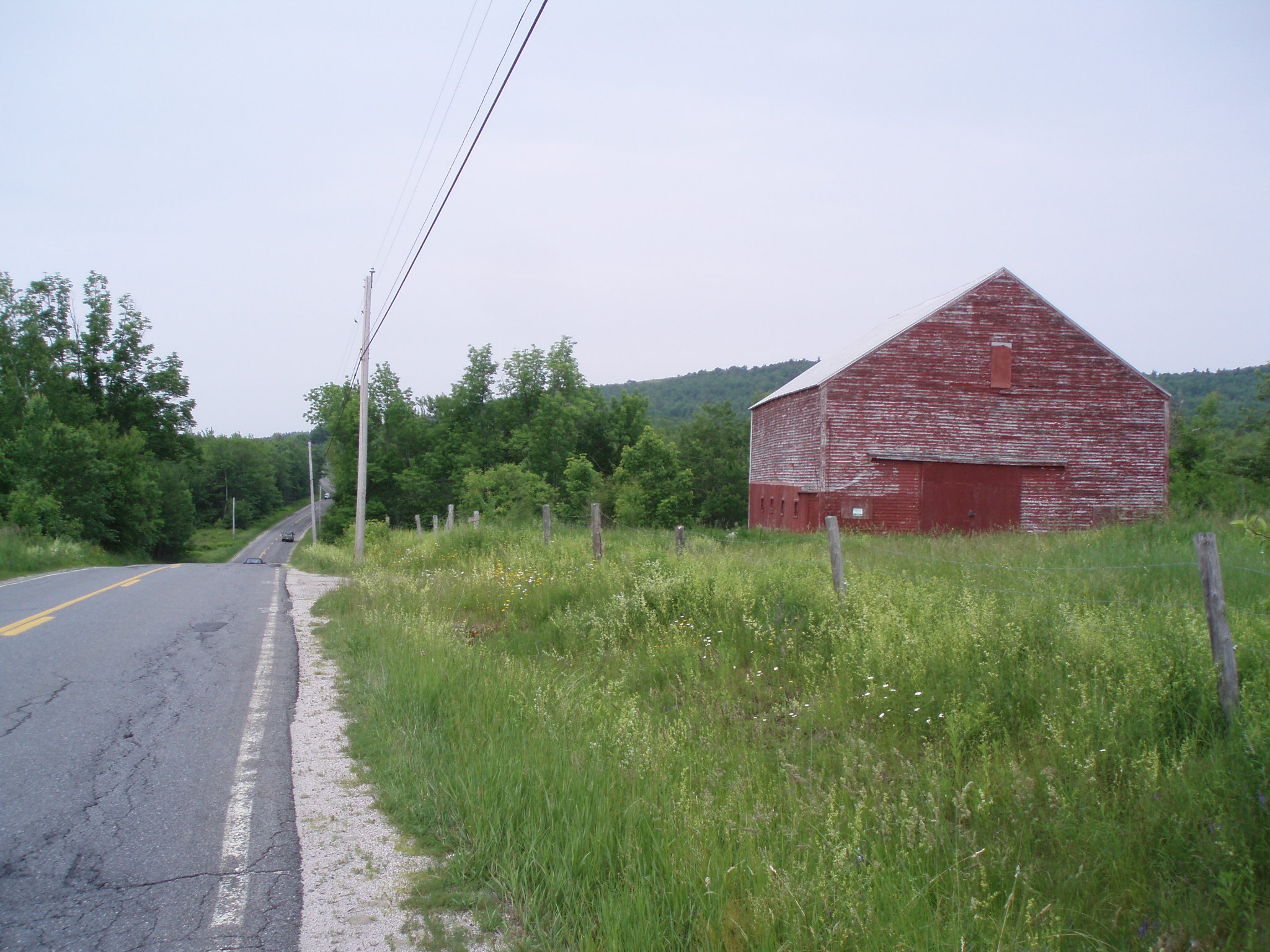 the road and the red house we passed by during our cross country bike tour