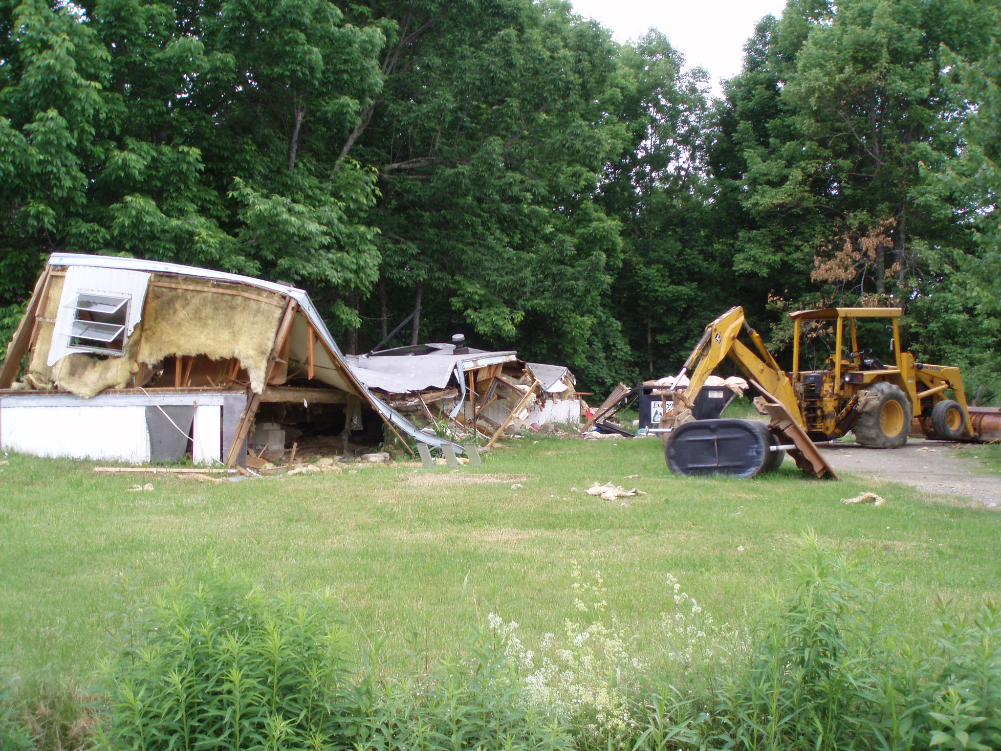 Dumptrucks and destroyed houses taken during our 2007 Coast2CoastBikeRide 