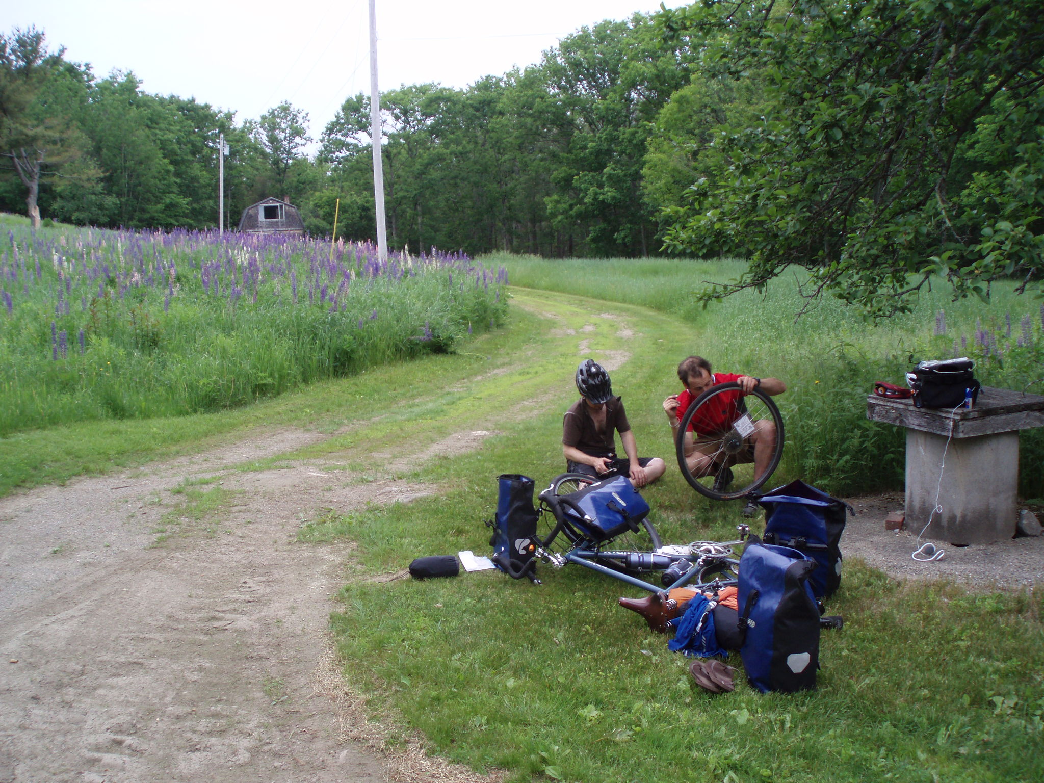 fixing our bikes during our cross country bike trip