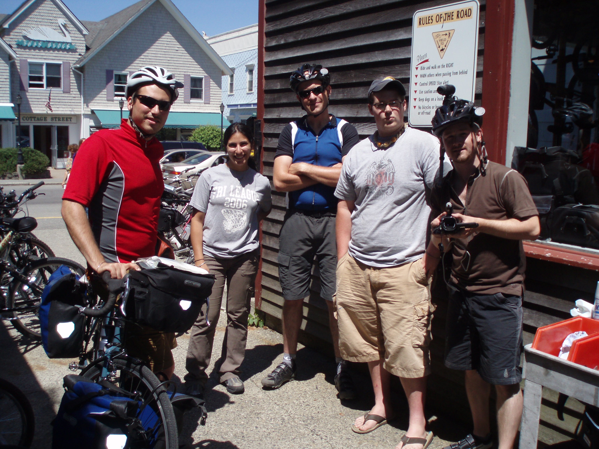 Group Photo of Mike, Chuck and Jamie meeting other people at a bike shop