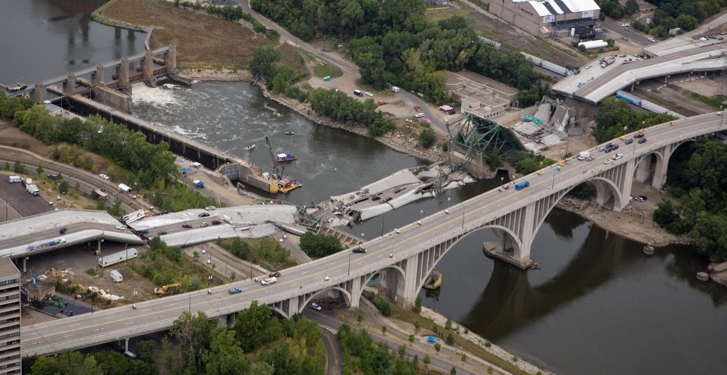 An aerial view shows the collapsed I-35W bridge 04 August 2007 in Minneapolis, Minnesota. Five people have been confirmed dead and 8 others missing following the 01 August bridge collapse during rush hour. AFP PHOTO/Mandel NGAN (Photo credit should read MANDEL NGAN/AFP/Getty Images)