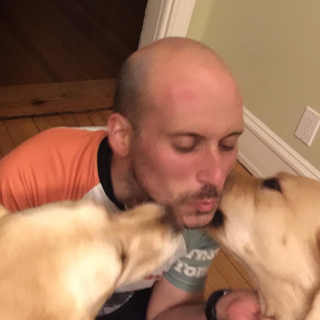 Michael Riscica and two dogs taken during the 2016 Coast to Coast Bike ride