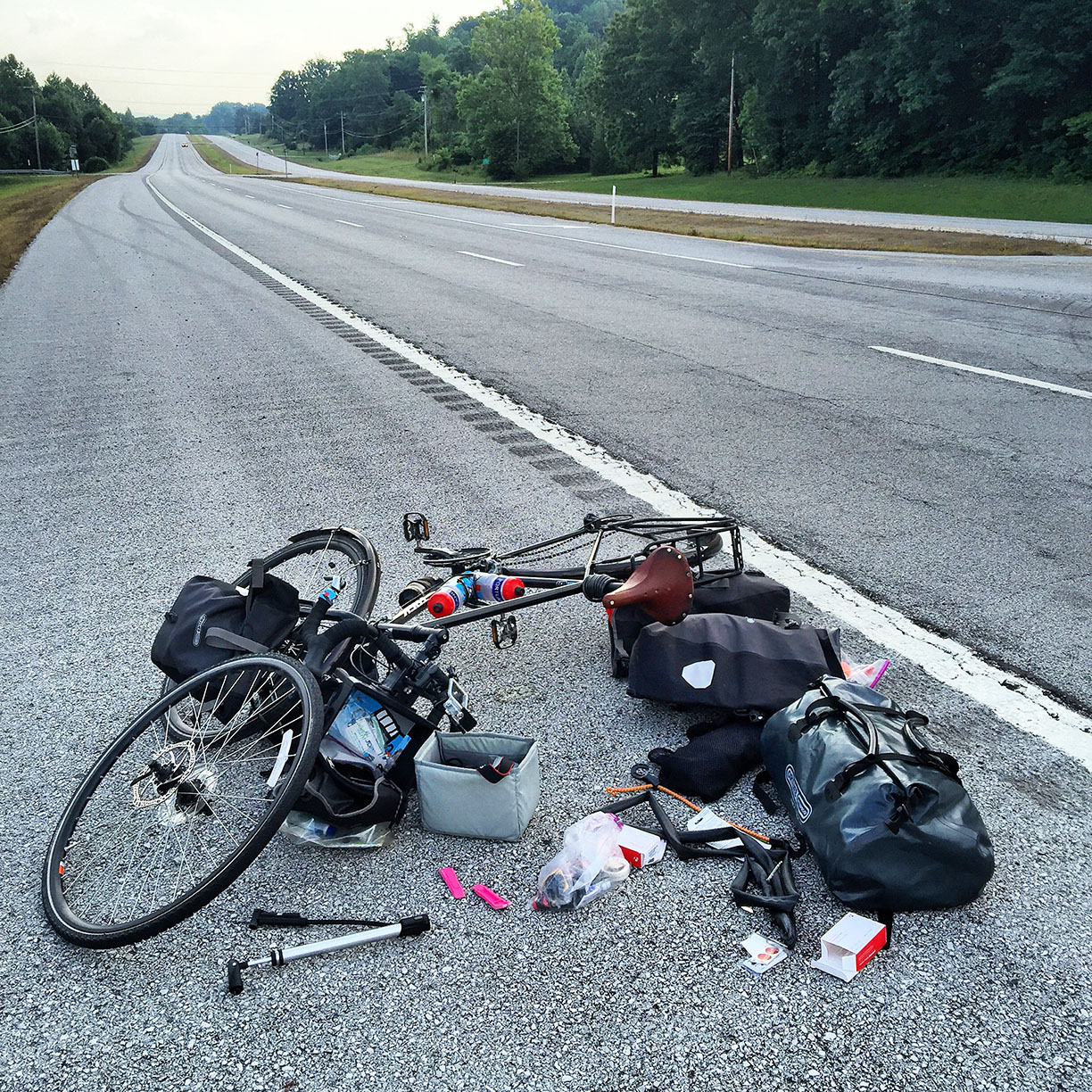 First flat tire today at mile 760! I didn't realize it, but I was also headed 7 miles down the road in the wrong direction. If I didn't get this flat tire I would have just kept going. #transam2016 #readthemap #dumbass #biketouring #flattire